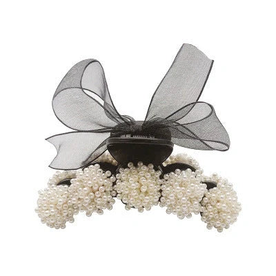 Korean pearl bow hair clip in black, alloy construction for durability and style.
