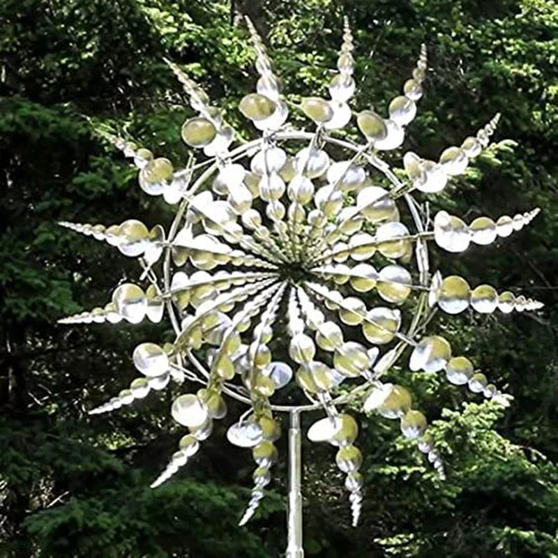 Elegant revolving metal windmill outdoor ornament with dual-layered blades creating a mesmerizing display in the garden