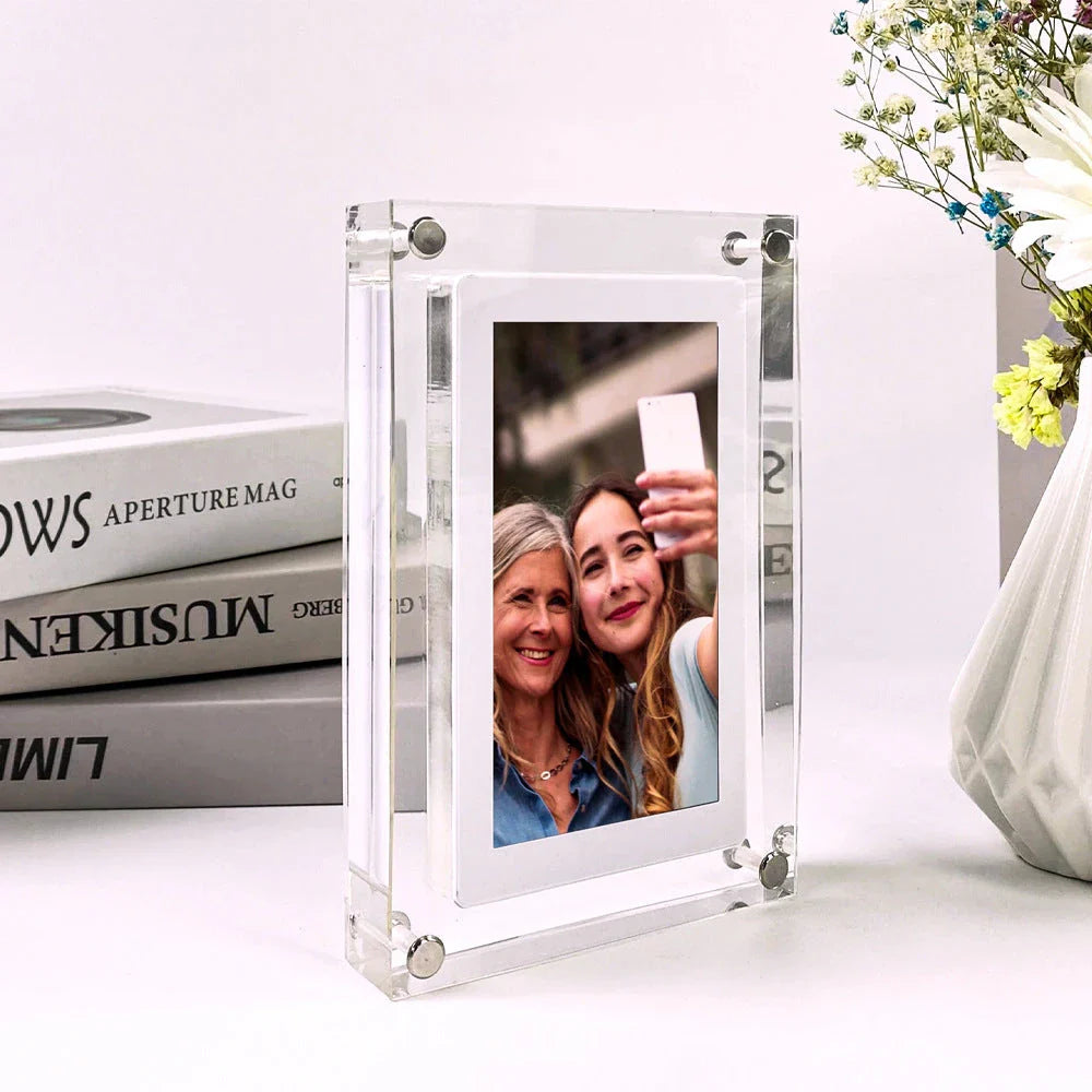 Stylish digital picture frame with acrylic exterior, supporting full HD video playback, automatic content recognition, and dual-speaker audio system