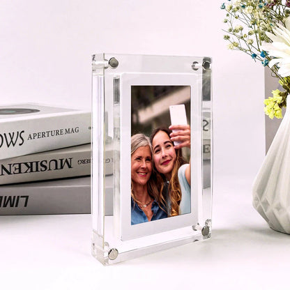 Stylish digital picture frame with acrylic exterior, supporting full HD video playback, automatic content recognition, and dual-speaker audio system
