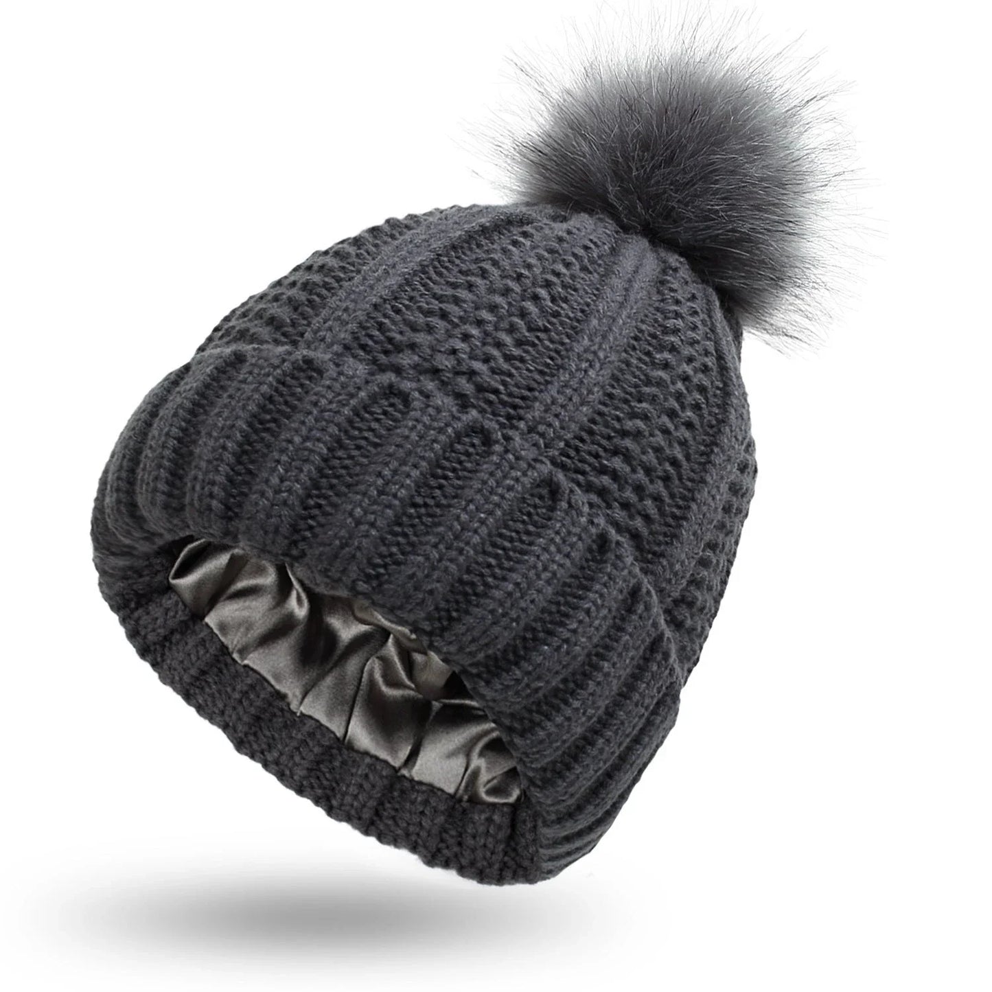 Stylish knit beanie with satin lining and faux fur pom-pom for women, available in multiple color options