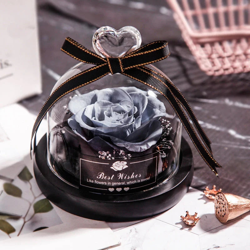 Enchanting Eternal Rose with LED lighting in a glass display, showcasing its timeless beauty and elegant design