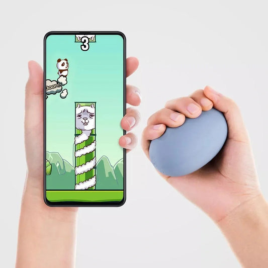 Smart Pinch Ball Grip Decompression Artifact in green and pink colors