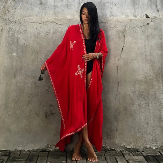Fashionable rayon beach cardigan with vibrant embroidered design, offering sun protection and versatile style for coastal holidays