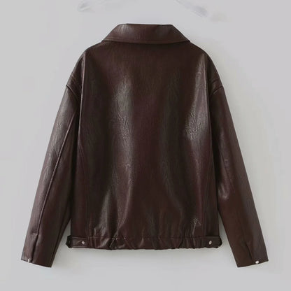 Fashionable faux leather jacket in burgundy and black colors, featuring a zipper closure and long sleeves for casual, versatile wear