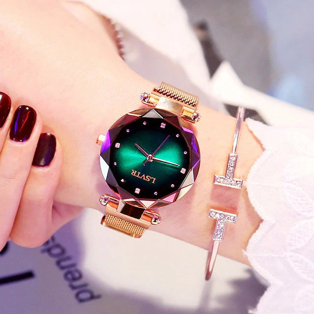 Elegant rose gold ladies' watch with diamond accents on a magnet strap