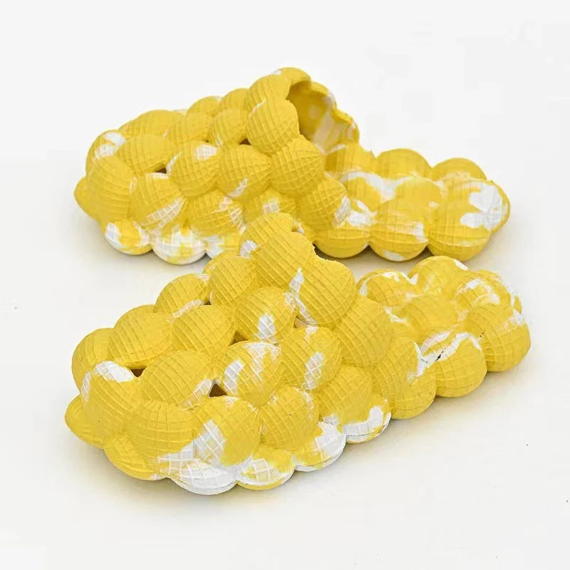 Comfortable massage bubble slides with breathable mesh upper and non-slip soles for indoor relaxation and pampering