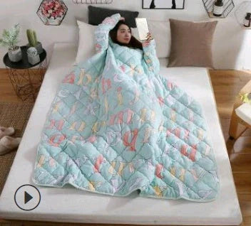 Cozy quilted lounger with sleeves in various colors and sizes, perfect for year-round indoor comfort and relaxation.
