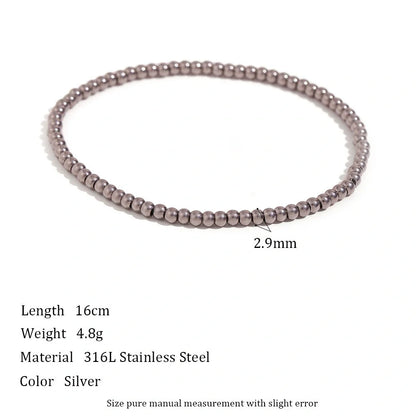 Vintage-inspired stainless steel and 18K plated elastic bead bracelet in a range of sizes and colours