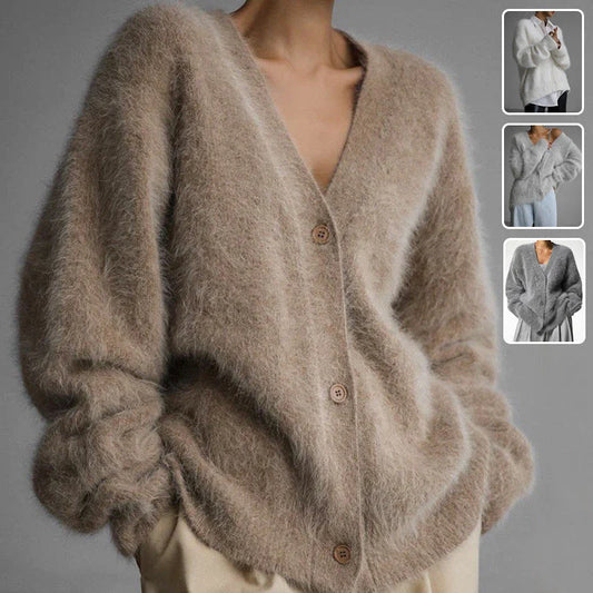 A stylish loose knit cardigan in a variety of colors, featuring a v-neck design and single-breasted closure for a flattering, relaxed fit.