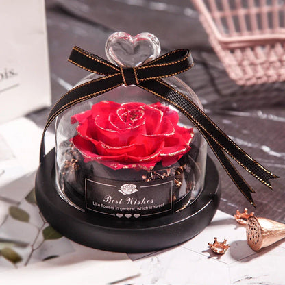 Enchanting Eternal Rose with LED lighting in a glass display, showcasing its timeless beauty and elegant design