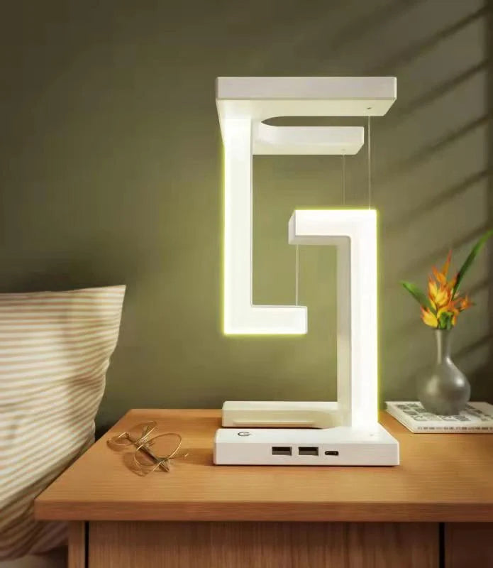 Floating table lamp with wireless charging for smartphones in modern minimalist design