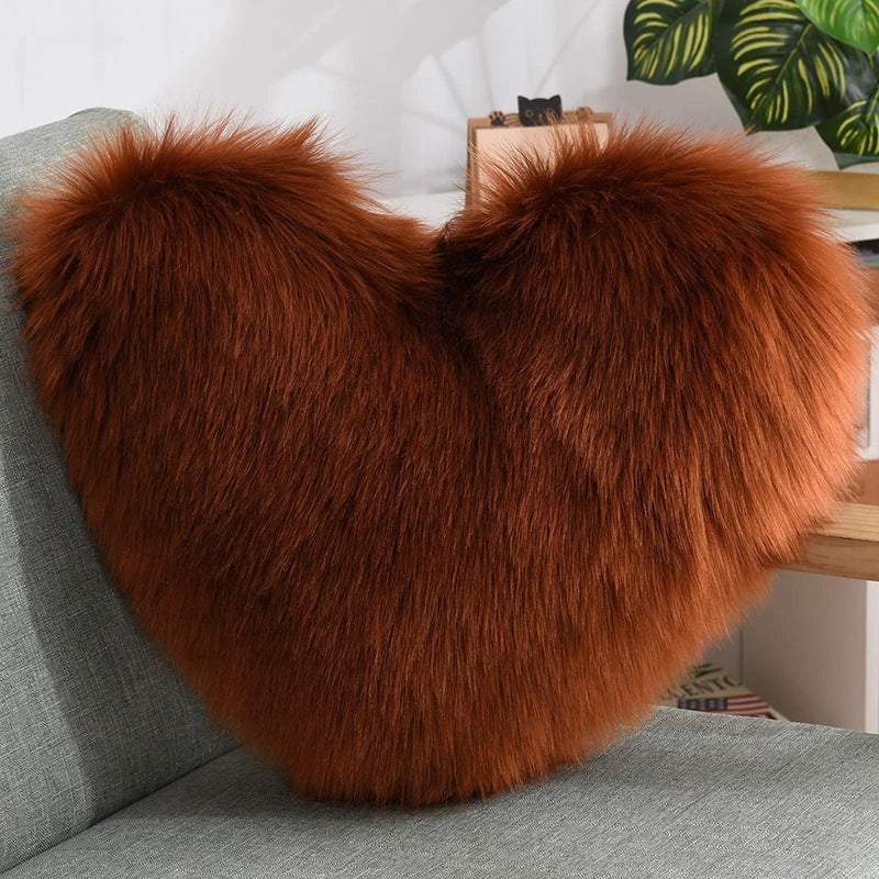 Cozy heart-shaped throw pillow with plush, shaggy texture in various colors