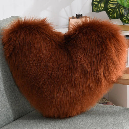 Cozy heart-shaped throw pillow with plush, shaggy texture in various colors