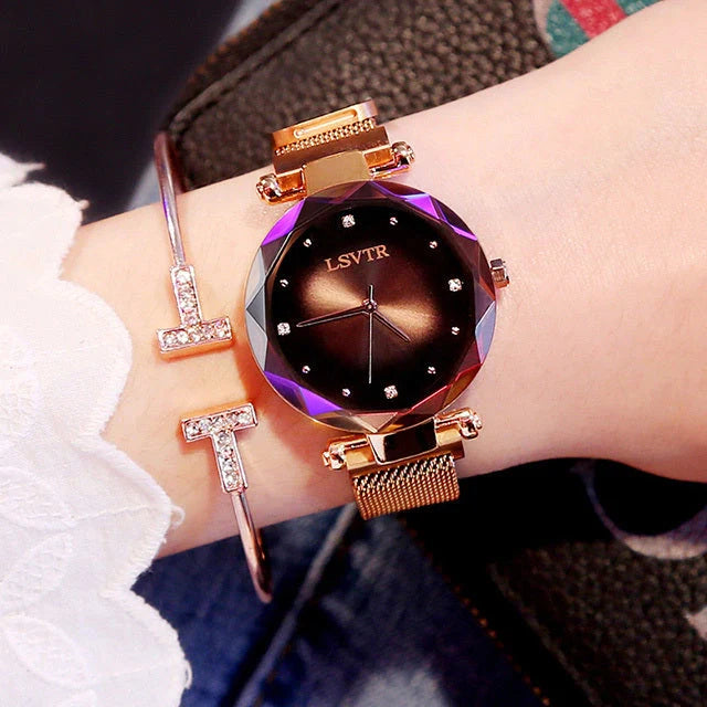 Elegant rose gold ladies' watch with diamond accents on a magnet strap