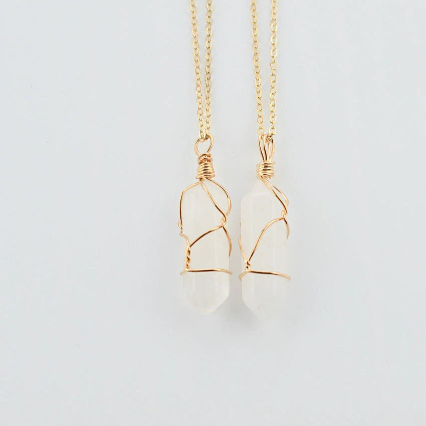 Elegant hexagonal quartz crystal necklace pendant on gold chain