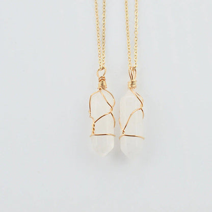 Elegant hexagonal quartz crystal necklace pendant on gold chain