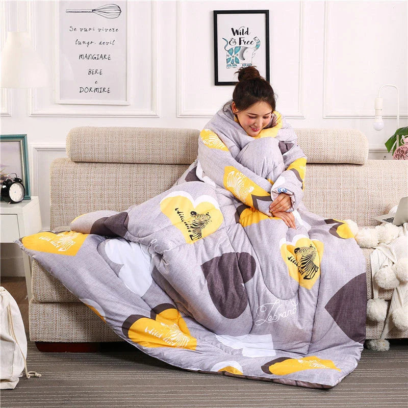 Cozy quilted lounger with sleeves in various colors and sizes, perfect for year-round indoor comfort and relaxation.