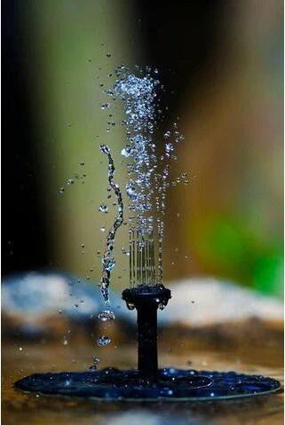 A solar-powered floating fountain with adjustable water jet heights, creating a mesmerising display in a British garden