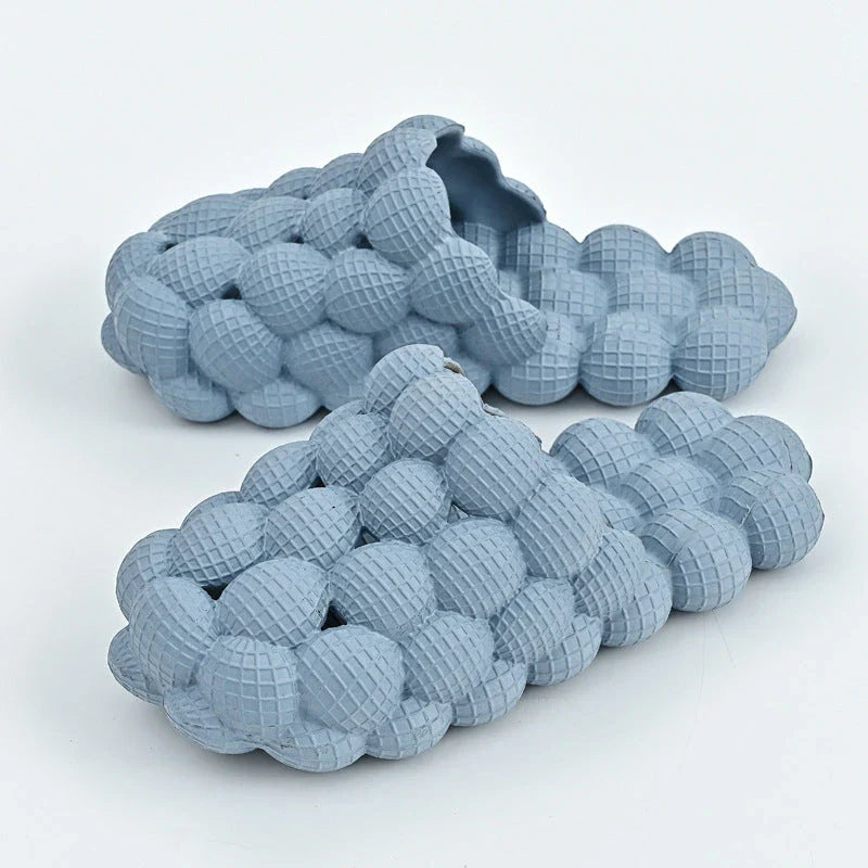Comfortable massage bubble slides with breathable mesh upper and non-slip soles for indoor relaxation and pampering