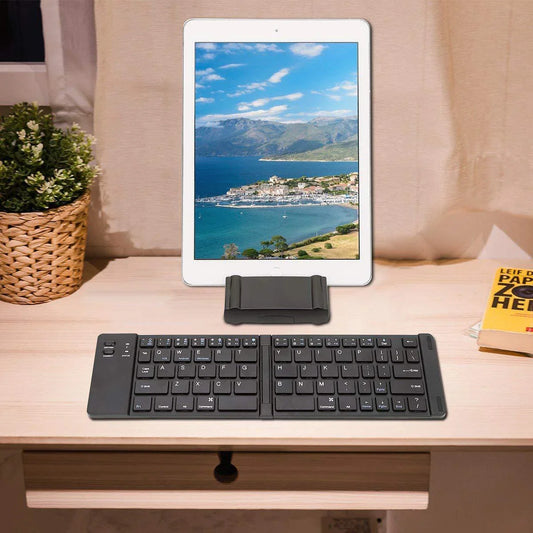 Compact and foldable Bluetooth keyboard for use with smartphones, tablets, and laptops