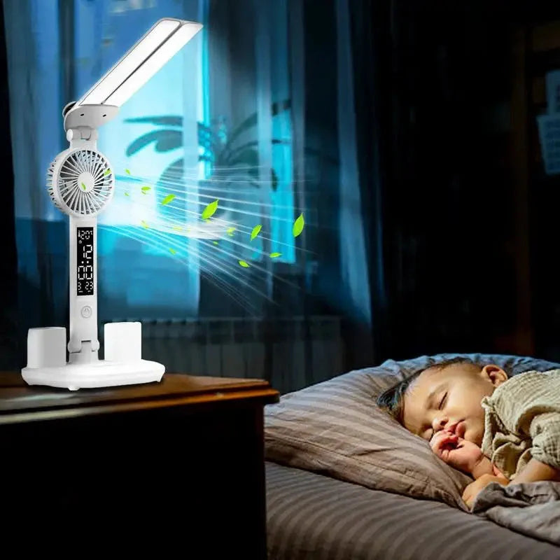 Foldable LED desk lamp with fan, thermometer, and pen holder on a tidy desk