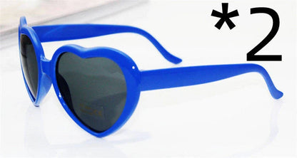 Stylish heart-shaped sunglasses with unique lens design that transforms light into enchanting special effects