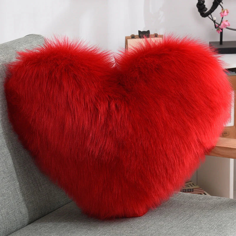 Cozy heart-shaped throw pillow with plush, shaggy texture in various colors