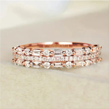 Elegant multilayer ring with a subtle geometric design, available in platinum, gold, and rose gold colours
