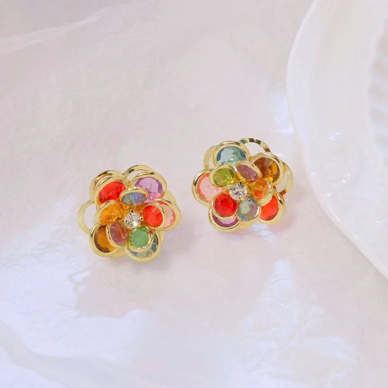 Small flower stud earrings for women in colour, black, and white options - sweet and trendy design