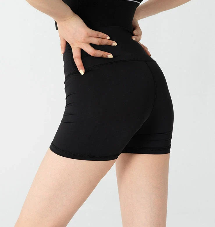 Luxurious silk leggings in black and natural shades, designed to flatter the figure with a light smoothing effect.