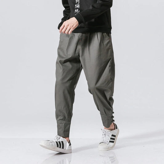Men's cotton blend casual trousers with button placket in black, blue, and grey
