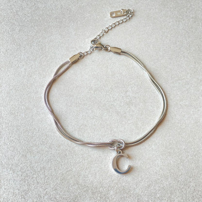 Personalised gold and silver love knot bracelets for couples, perfect as Valentine's Day gifts.