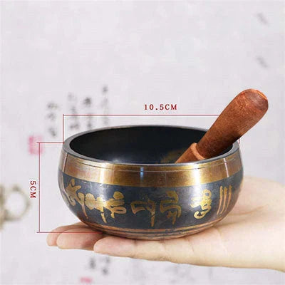 A handcrafted Tibetan singing bowl made of copper, used for meditation and relaxation.