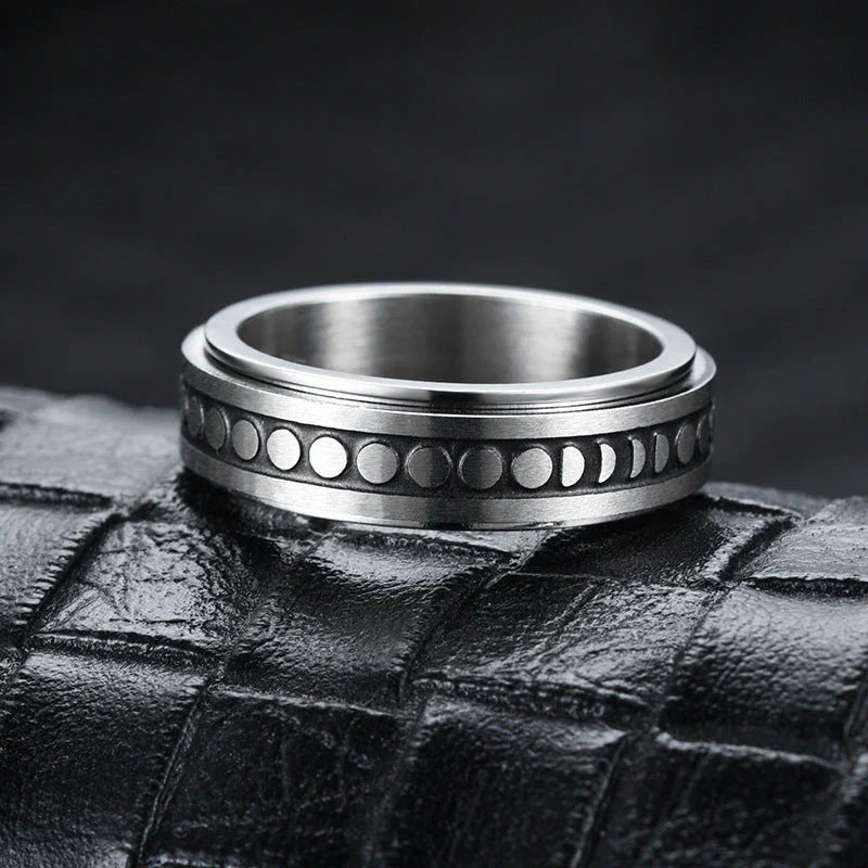 Elegant stainless steel spinner ring with a captivating moon and star design that rotates effortlessly for a calming tactile experience