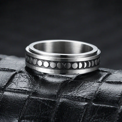 Elegant stainless steel spinner ring with a captivating moon and star design that rotates effortlessly for a calming tactile experience