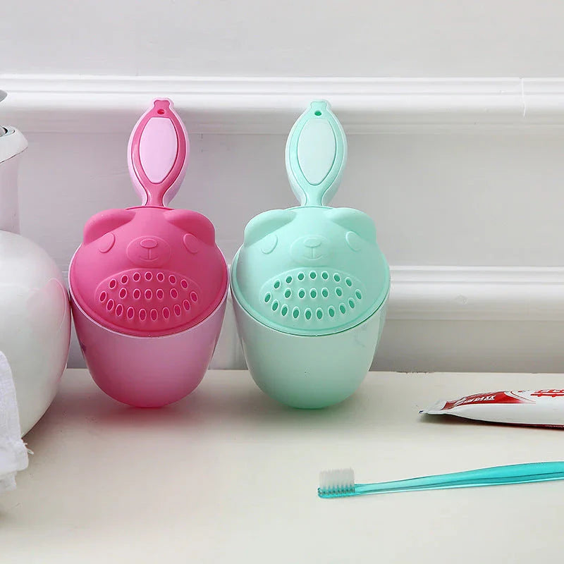Shampoo rinse cup for baby bath time with comfortable handle and bright, colourful design