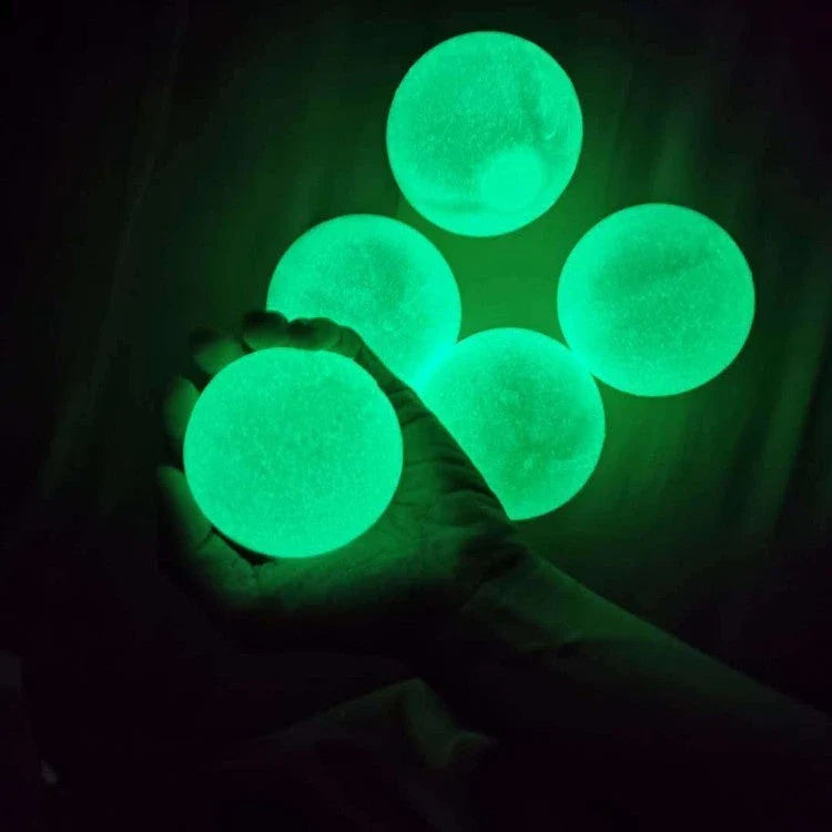 Premium Luminous Sticky Stress Relief Balls in various colors and sizes, with a glow-in-the-dark feature for a captivating and soothing relaxation experience.