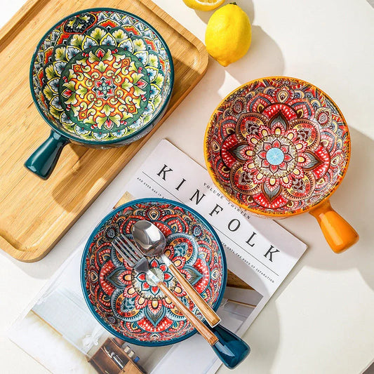 Set of elegant ceramic dessert bowls featuring hand-painted floral patterns in blue, red, and green glazes