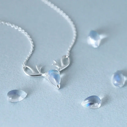 Elegant silver-toned elk necklace with a captivating moonstone pendant, a stunning Korean-inspired jewellery piece