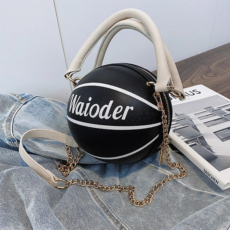 Basketball-shaped handbag in pink, white, black, or brown with adjustable chain shoulder strap
