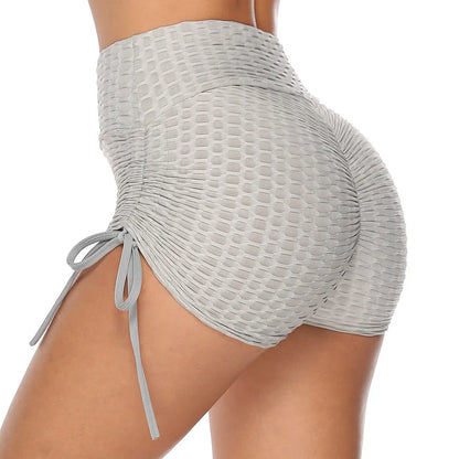 Stylish butt-lifting workout shorts with drawstring, available in various colors including pink, red, grey, navy, and black