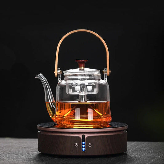 Elegant Japanese-style glass teapot with bamboo handle, perfect for brewing loose-leaf teas