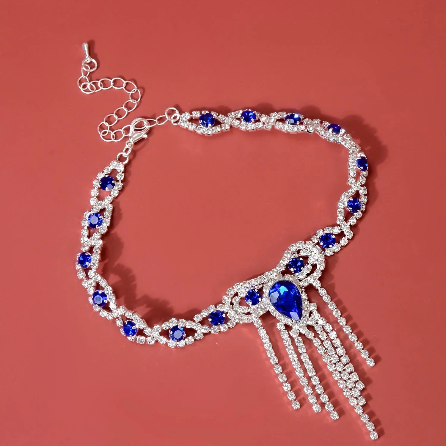Elegant blue rhinestone tassel anklet for women, perfect for adding glamour to any outfit.