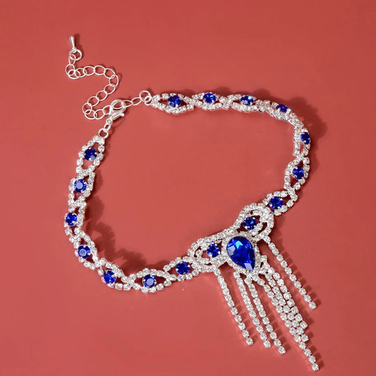 Elegant blue rhinestone tassel anklet for women, perfect for adding glamour to any outfit.