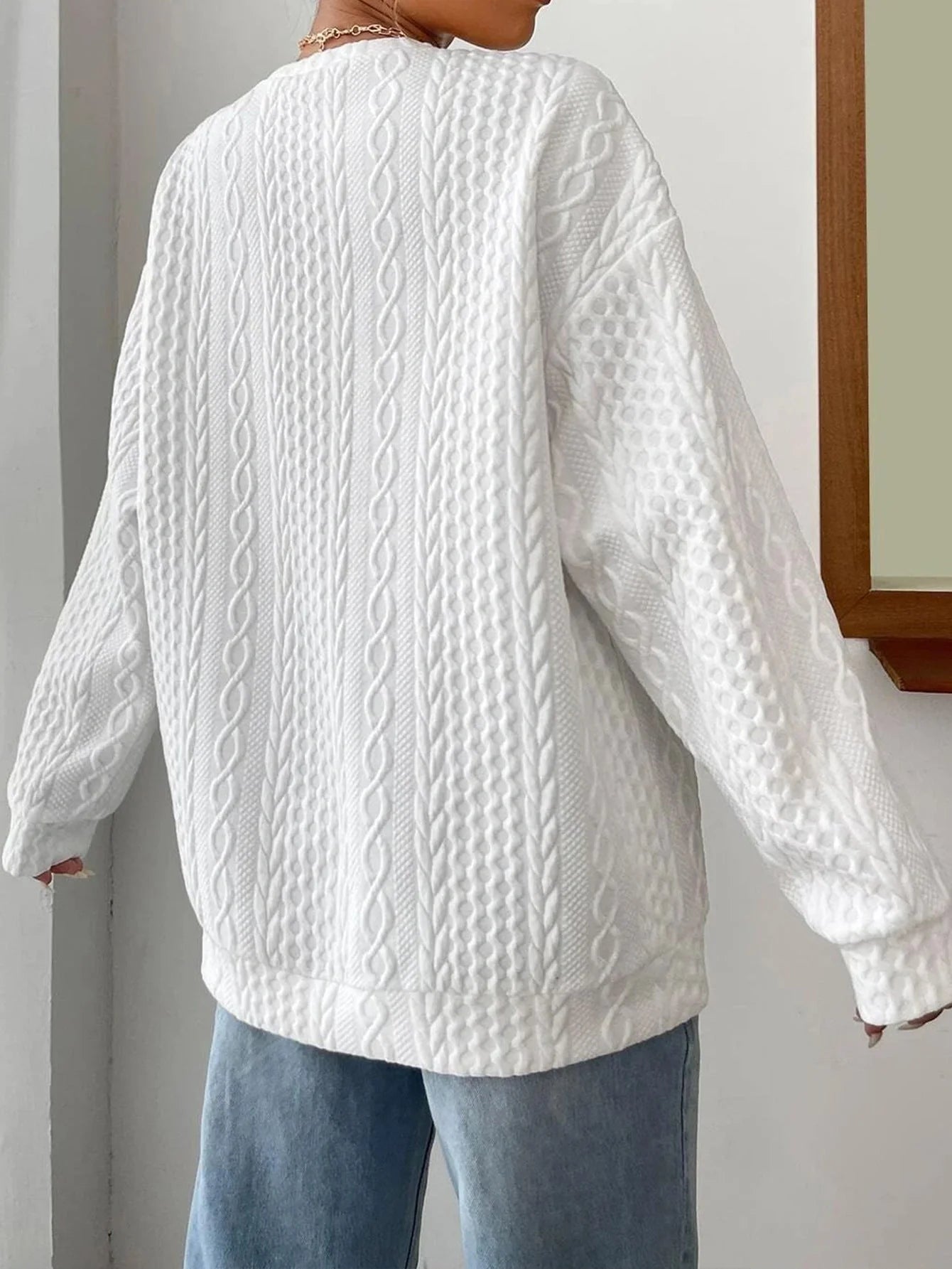 Cosy and stylish women's oversized jacquard hoodie in black, white, and blue colours