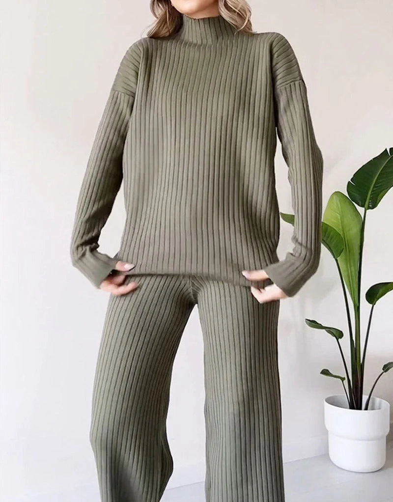 Women's turtleneck knitted suit set in white, black, or green with loose fit and straight trousers