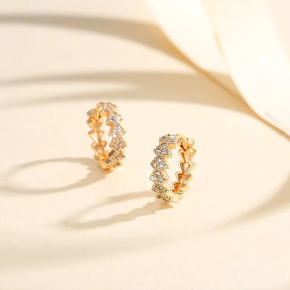 Premium copper-plated gold and zircon stud earrings in a classic design, exuding British elegance and sophistication