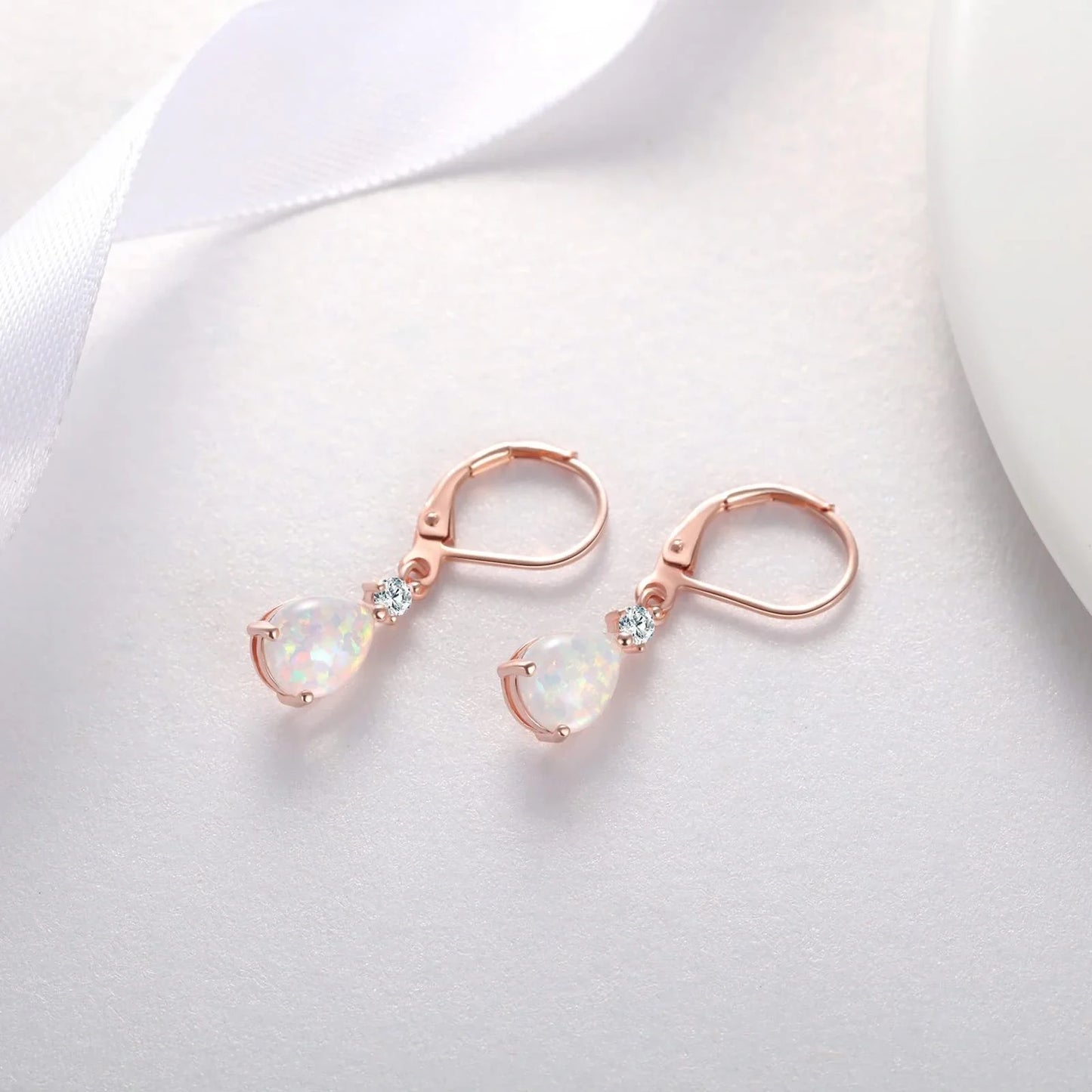 Elegant White Opal Drop Earrings for women with Australian opals in a geometric water droplet design