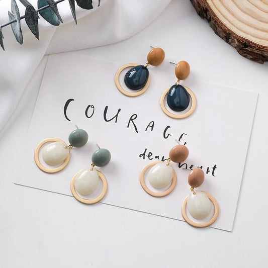 Elegant candy drop earrings in pink, green, and blue shades, showcasing a stylish and durable alloy design